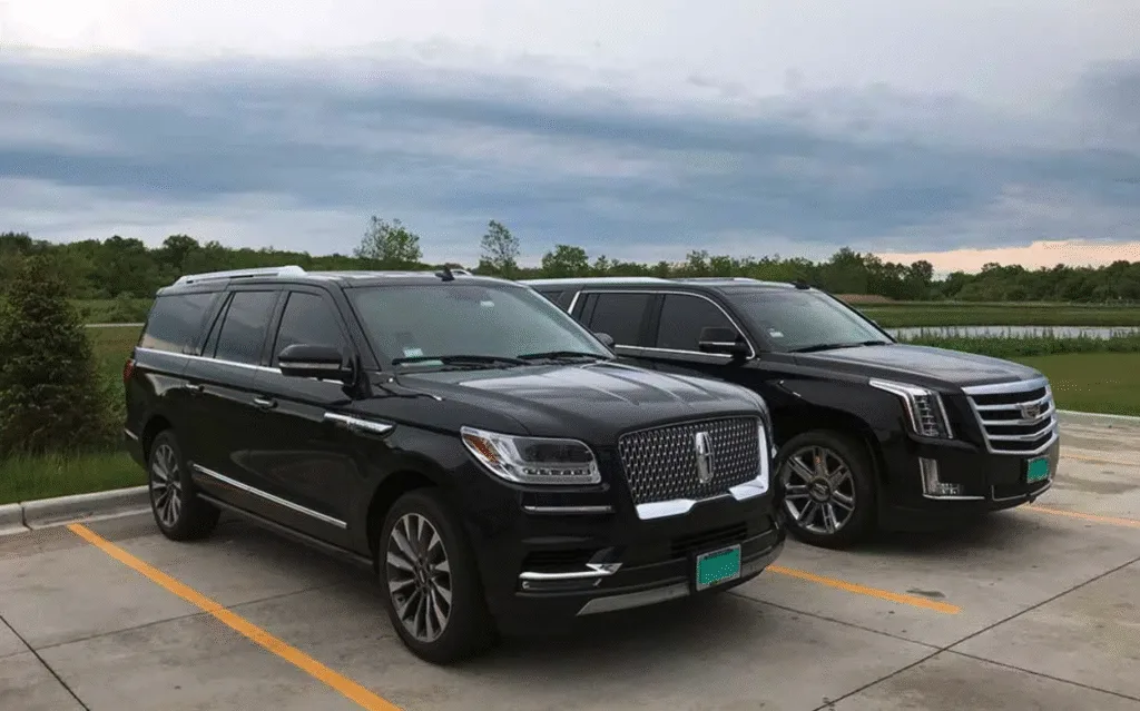 Two black luxury SUVs side by side