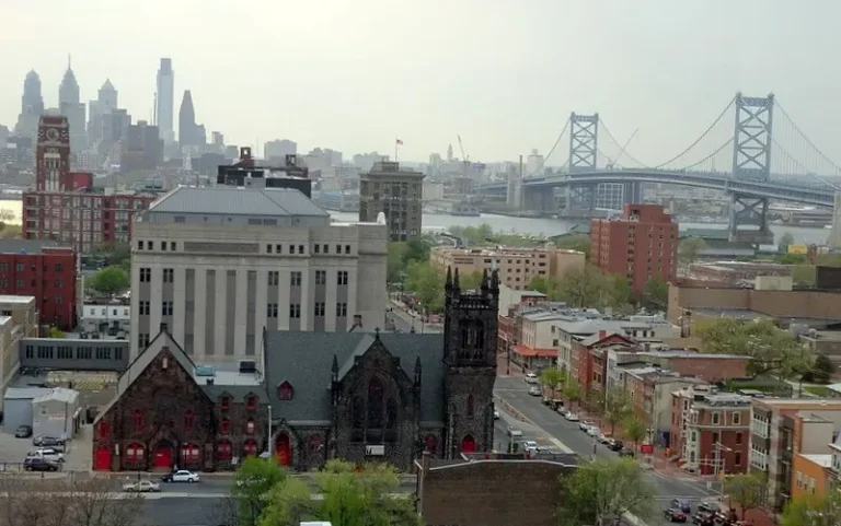 Camden, New Jersey with the Philadelphia skyline and Ben Franklin Bridge behind